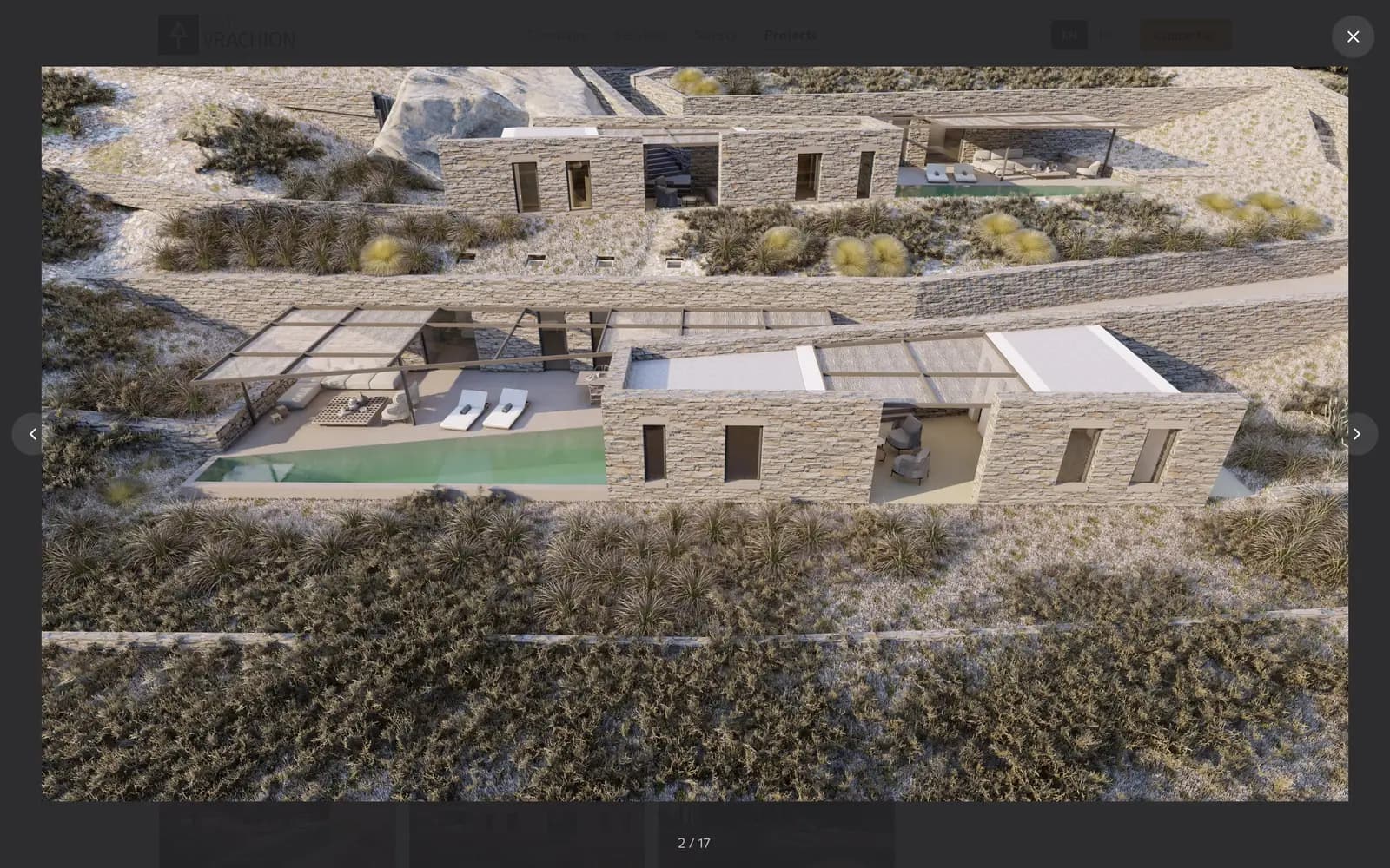 The full-screen gallery: a photo of stone villas with previous and next arrows, a close button and the counter 2 / 17
